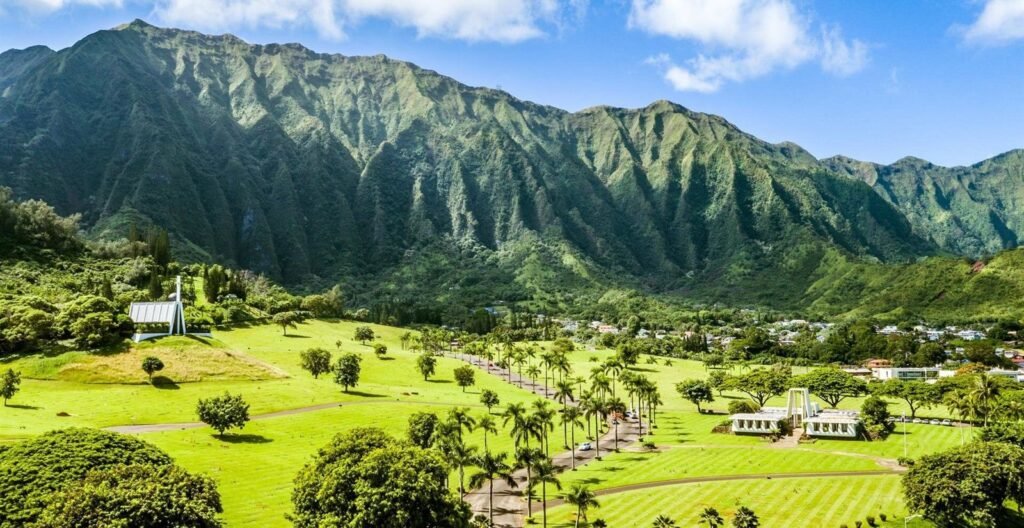 Green lawns of Valley of the Temples Memorial Park below the Koolau mountains in Kaneohe